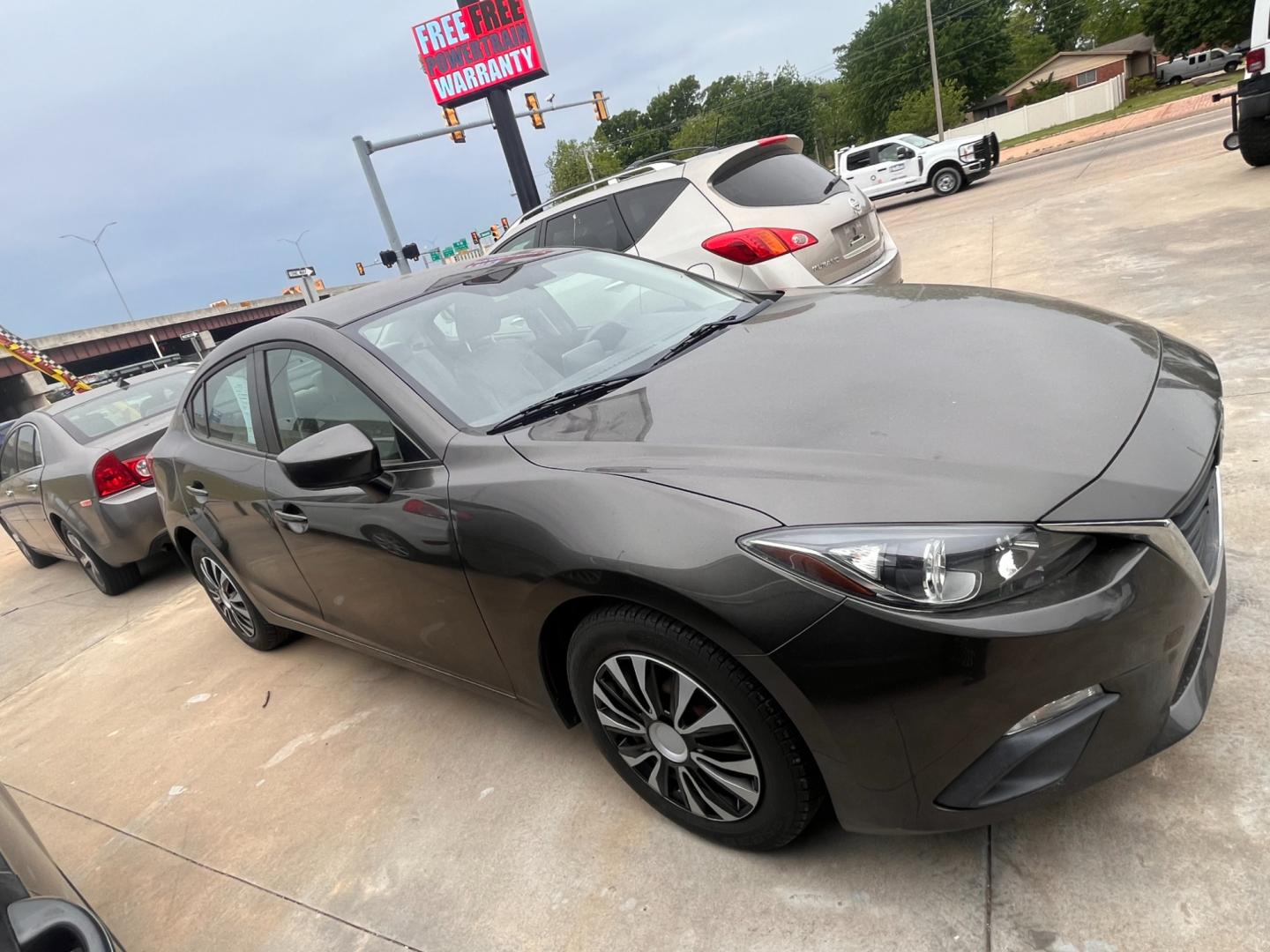 2015 BEIGE MAZDA MAZDA3 I SPORT W/SKY i Sport AT 4-Door (3MZBM1U73FM) with an 2.0L L4 DOHC 16V engine, 6-Speed Automatic transmission, located at 8101 E. Skelly Dr., Tulsa, OK, 74129, (918) 592-3593, 36.121891, -95.888802 - Photo#2